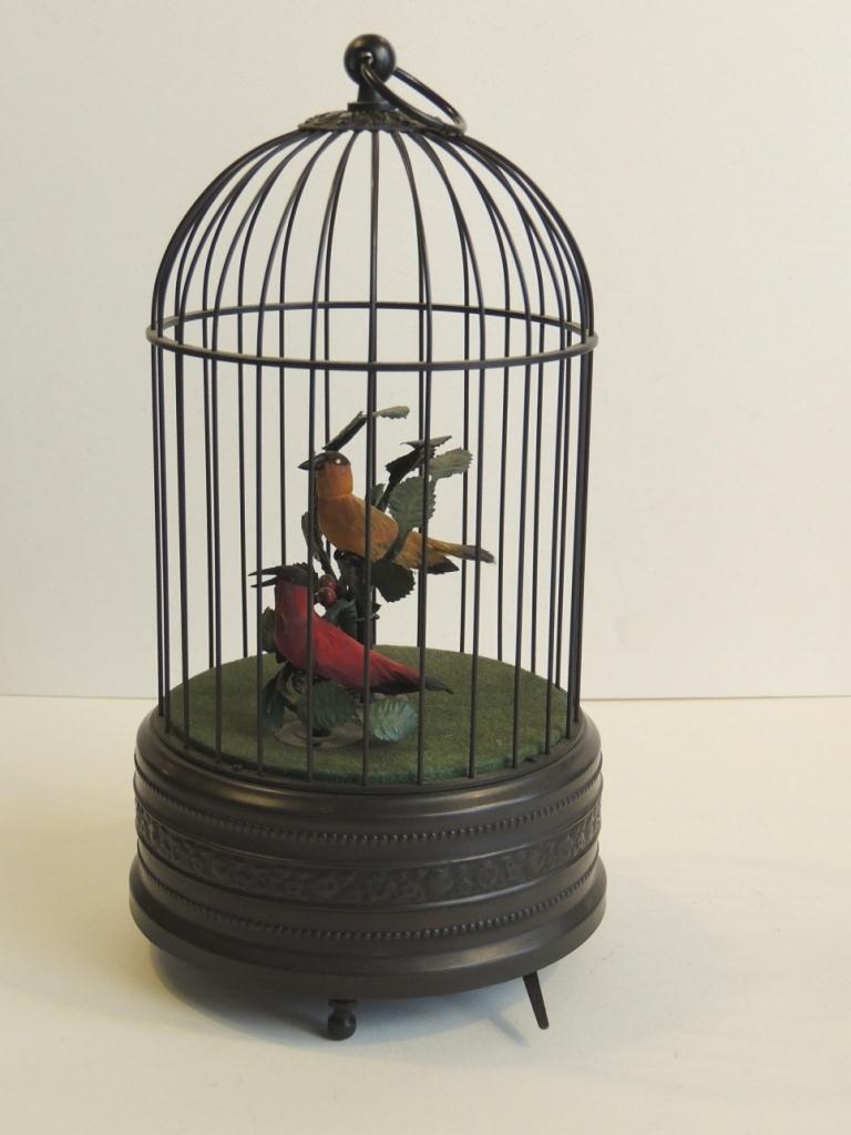 Automa gabbia con uccellini.